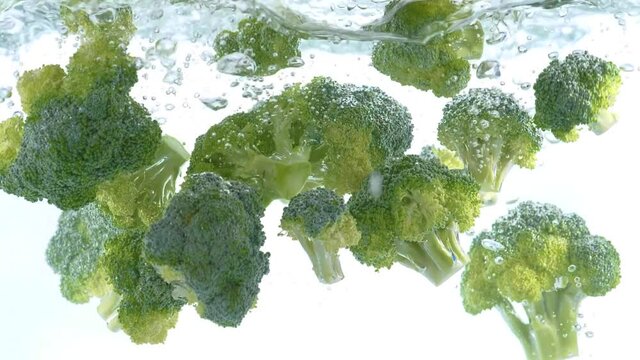 Broccoli Cabbage Falling Into Water