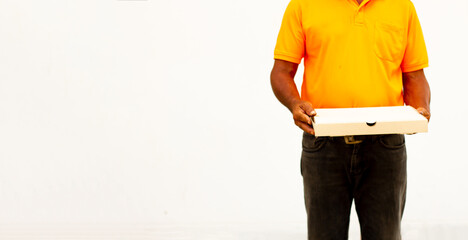 Holding various take-out food containers in holder and paper bag, close-up. Light grey background, place to insert your text. Delivery man.