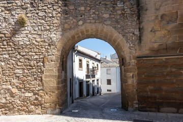 Fototapeta na wymiar Arco de las Escuelas o de San Leon in street Conde Romanones, Baeza, Jaen province, Andalucia, Spain