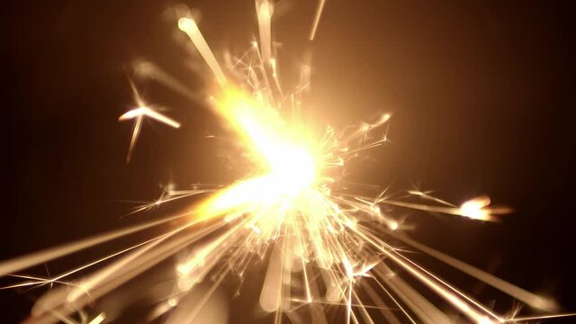 Overhead view of a burning sparkler firework with hot glowing embers. For 4th of July or New years celebration.