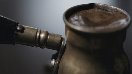 close up of Turkish coffee in copper pot