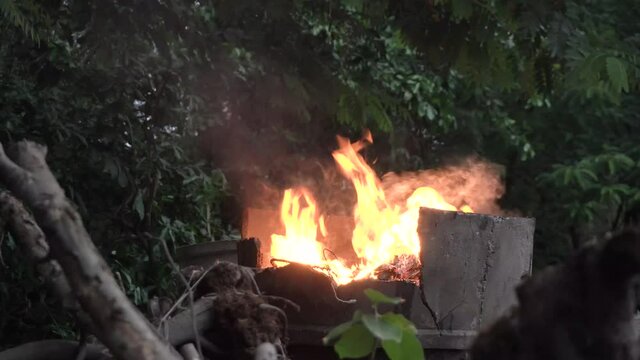 Destruction of garbage by means of burning in a Garden incinerator bin. Cause smoke, which air pollution. Not helping the environment.