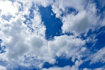 Naklejka na ściany i meble The sky background of white clouds on a clear day