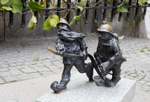 WROCLAW, POLAND - OCTOBER 22: Sculpture of gnome from fairy-tale made by Tomasz Moczek on the street on October 22, 2013 in Wroclaw, Poland. The more than 250 gnomes are touristic symbol of the city.