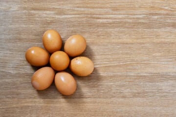 Eggs on a wooden background. Place for text. Food concept.