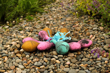 Deflated balloons on the pebble