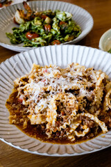 Reginette pasta with pork Bolognese sauce