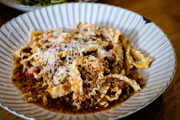 Reginette pasta with pork Bolognese sauce