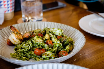 Reginette pasta with seafood pesto sauce