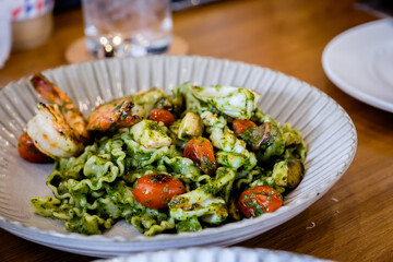 Reginette pasta with seafood pesto sauce