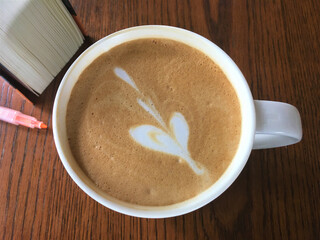 cup of coffee on wooden table