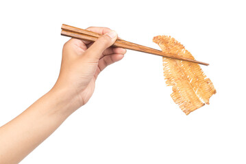 Hand holding spicy crispy squid by chopsticks isolated on white background