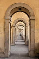 Fototapeta na wymiar View of walkway below a section of the Vasari Corridor Florence