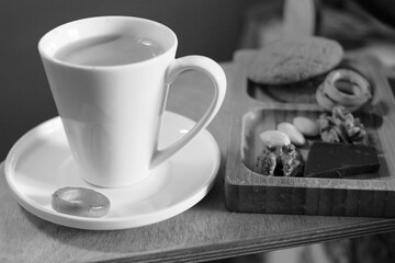 Coffee in a cup and nuts for breakfast