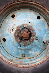 steampunk background, tractor wheel close-up, metal and rust