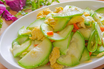 zucchini squash and eggs stir fry close up. Chinese food