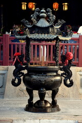 Tainan, Taiwan-May 17, 2019: Censer with lots of burning incense sticks. Incense burner at Official God of War Temple.