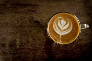 cup of coffee on wood floors
