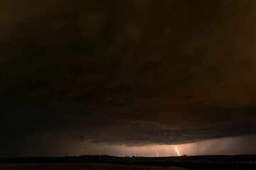 Lightnings in Summer Storm with Dramatic Clouds