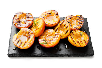Summer dessert. Ripe grilled peaches with honey isolated on white background
