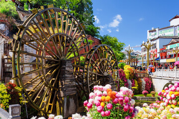 Ornamental water mills and flowers, the Old Town of Lijiang