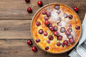 Traditional french pie clafoutis with cherry . top view