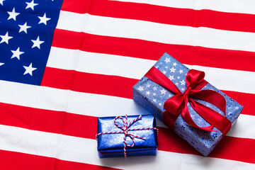 Fototapeta na wymiar 4th of July American Happy Independence Day card with gift boxes in national colors american flag on white background