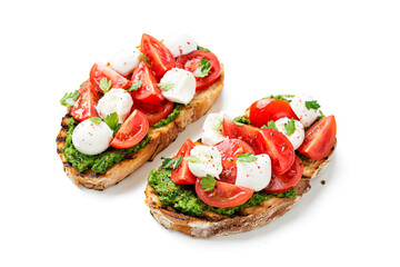 Bruschetta with cherry tomatoes, mozzarella cheese and pesto sauce . Traditional italian appetizer or snack, antipasto. isolated on white background