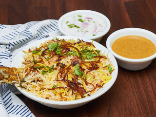 Chicken Biryani is a savory chicken and rice dish that includes layers of chicken, rice, and aromatics that are steamed together.