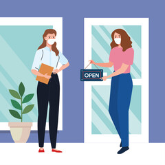 Obraz na płótnie Canvas open again after quarantine, women with label of reopening of shop, we are open again, store shop facade vector illustration design