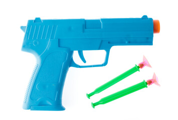 Plastic toy gun with darts isolated on white background