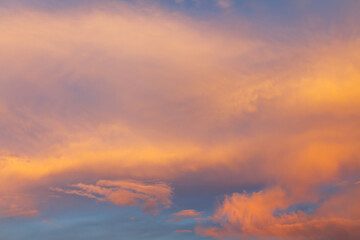Clouds painted in the color of sunset