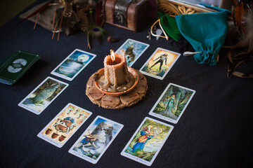 Mystical atmosphere, view of tarot card on the table, esoteric concept, fortune telling and predictions - obrazy, fototapety, plakaty