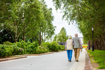 Old couple walking in the park 