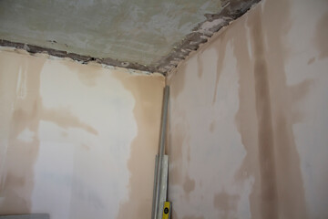 Repair work in the apartment. Concept of home improvement or renovate. Primed painting walls