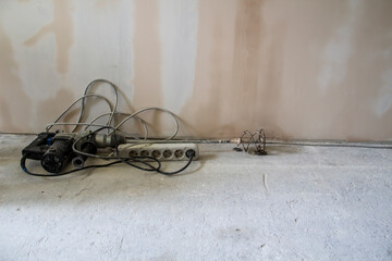 Fototapeta na wymiar Repair work in the apartment. Concept of home improvement or renovate. A drill mixer for repair.