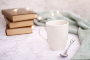cup of coffee with books and bokeh