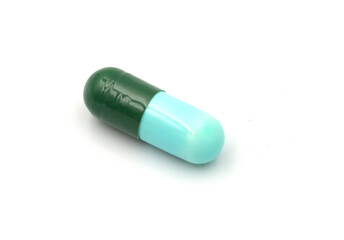 green pills isolated on white
