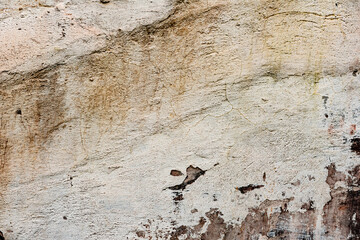 Texture of a concrete wall with cracks and scratches which can be used as a background