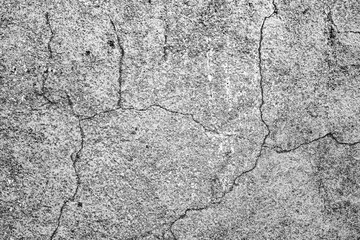 Texture of a concrete wall with cracks and scratches which can be used as a background