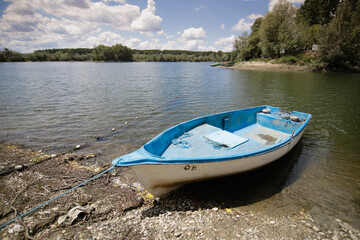 Fishing boat on the Danube River shore in Romania.