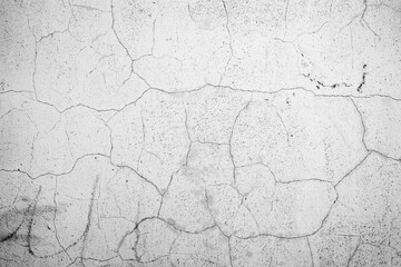 Texture of a concrete wall with cracks and scratches which can be used as a background