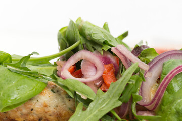 Fragment of dish chicken kebab and a salad.