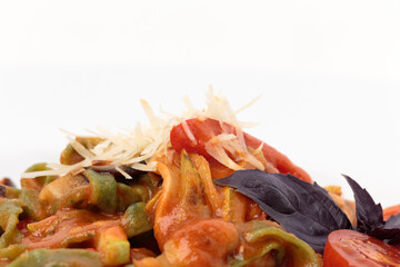 Fragment of pasta tagliatelle with tomato sauce.