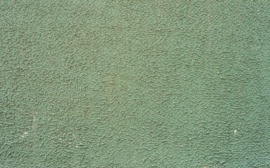 Texture of a concrete wall painted in light green