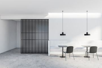 White and black cafe interior with bench