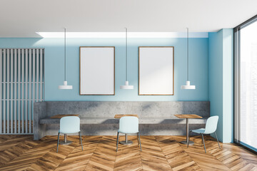 Blue cafe interior with bench and poster gallery