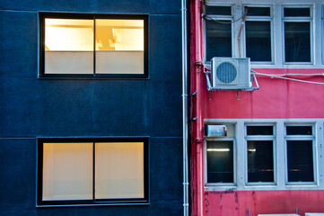 Obraz premium Contrast colour scene of blue and pink building walls in Hong Kong China SAR in the evening