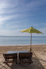 yellow beach umbrella and sunbed, Koh Mak beach, Koh Mak Island , Thailand.