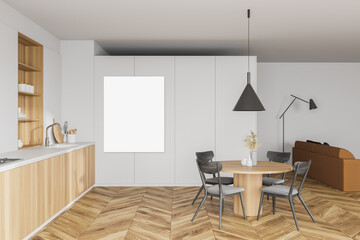 White kitchen and living room with poster